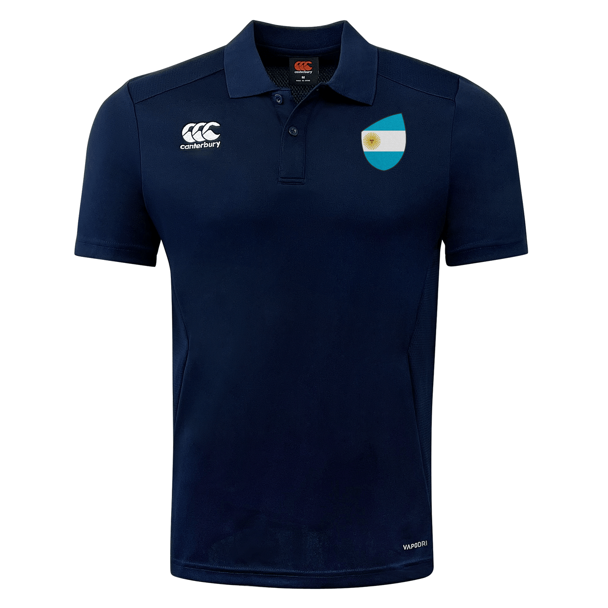 Navy blue polo shirt with white logos on the chest. The left logo features a white lotus flower, while the right showcases a blue shield with a white stripe and a golden sun. Perfect for rugby enthusiasts, this Argentina Shield Club Dry Polo from EMB Canterbury integrates advanced Vapodri technology for ultimate comfort.