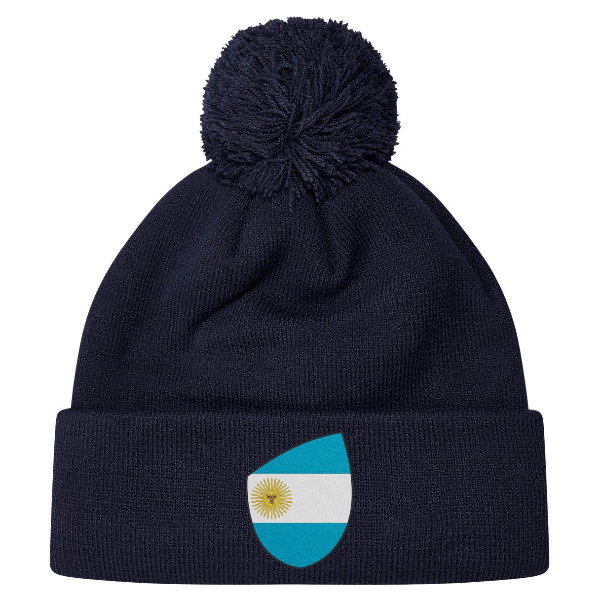 The EMB Canterbury Argentina Shield Pom Pom Beanie in navy blue features a fun patch with a sun-centered flag, adding flair to your winter wardrobe.