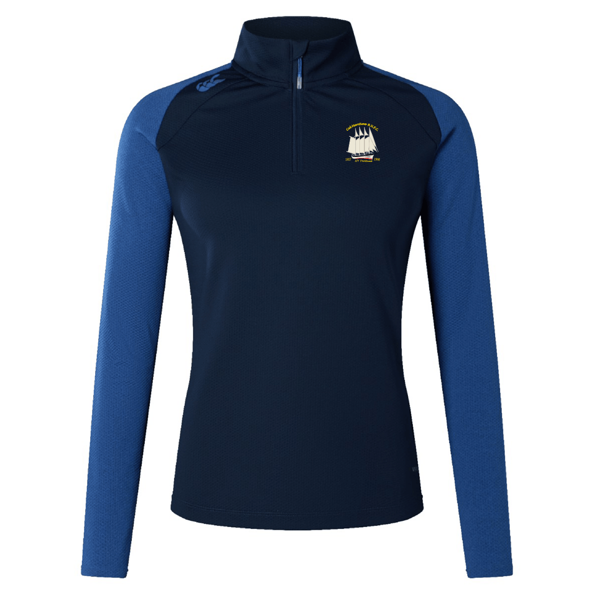 The Cal Maritime Rugby Women's Elite First Layer by EMB Canterbury is a navy and blue long-sleeve athletic top with a quarter-zip front, VapoDri moisture-wicking tech, and an embroidered ship logo on the chest. Inspired by Canterbury's elite design.