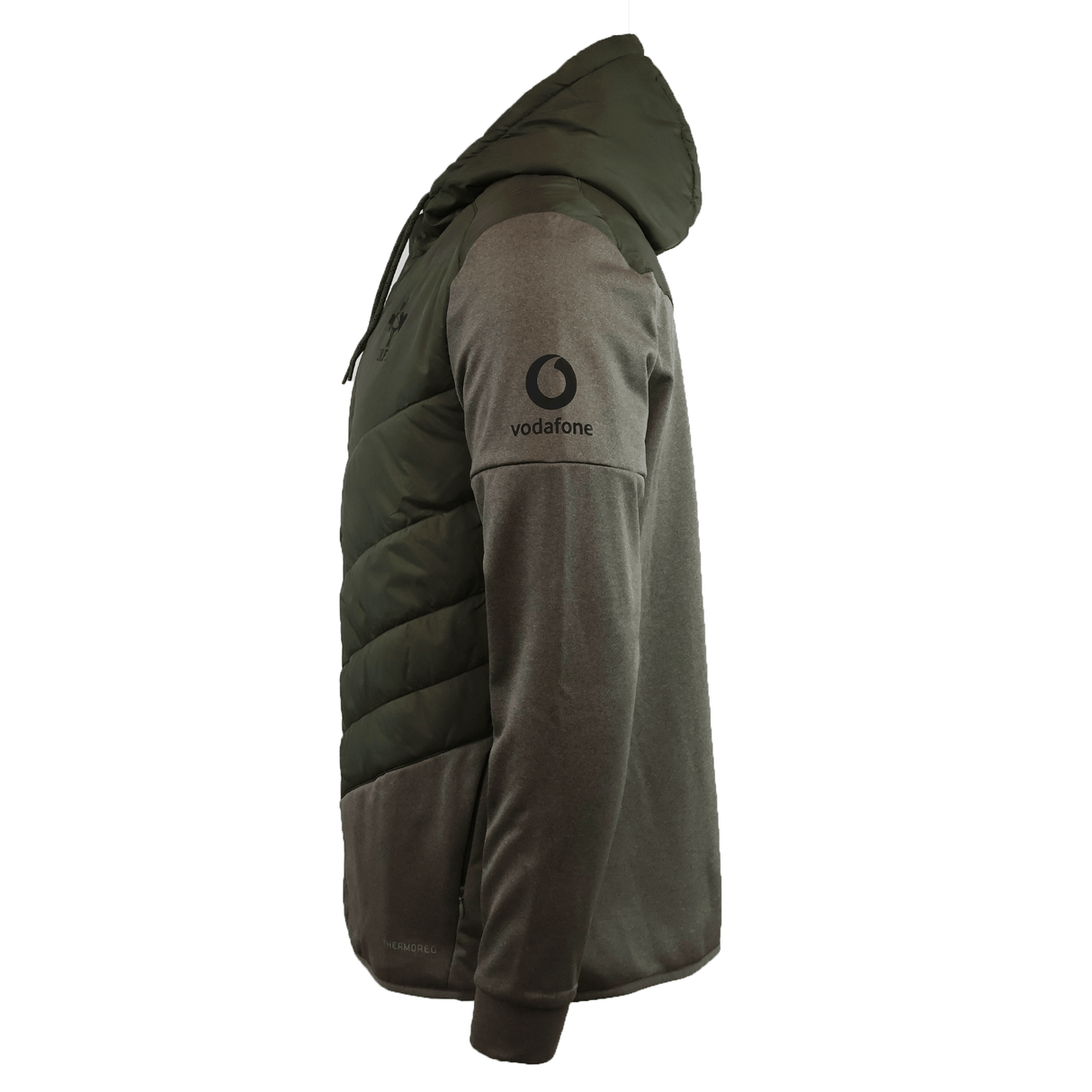 Side view of the Canterbury Ireland 25/26 Hybrid Padded Jacket with Vodafone sleeve logo, featuring quilted ThermoReg heat retention on the upper body and plain water-resistant fabric on sleeves and lower body.