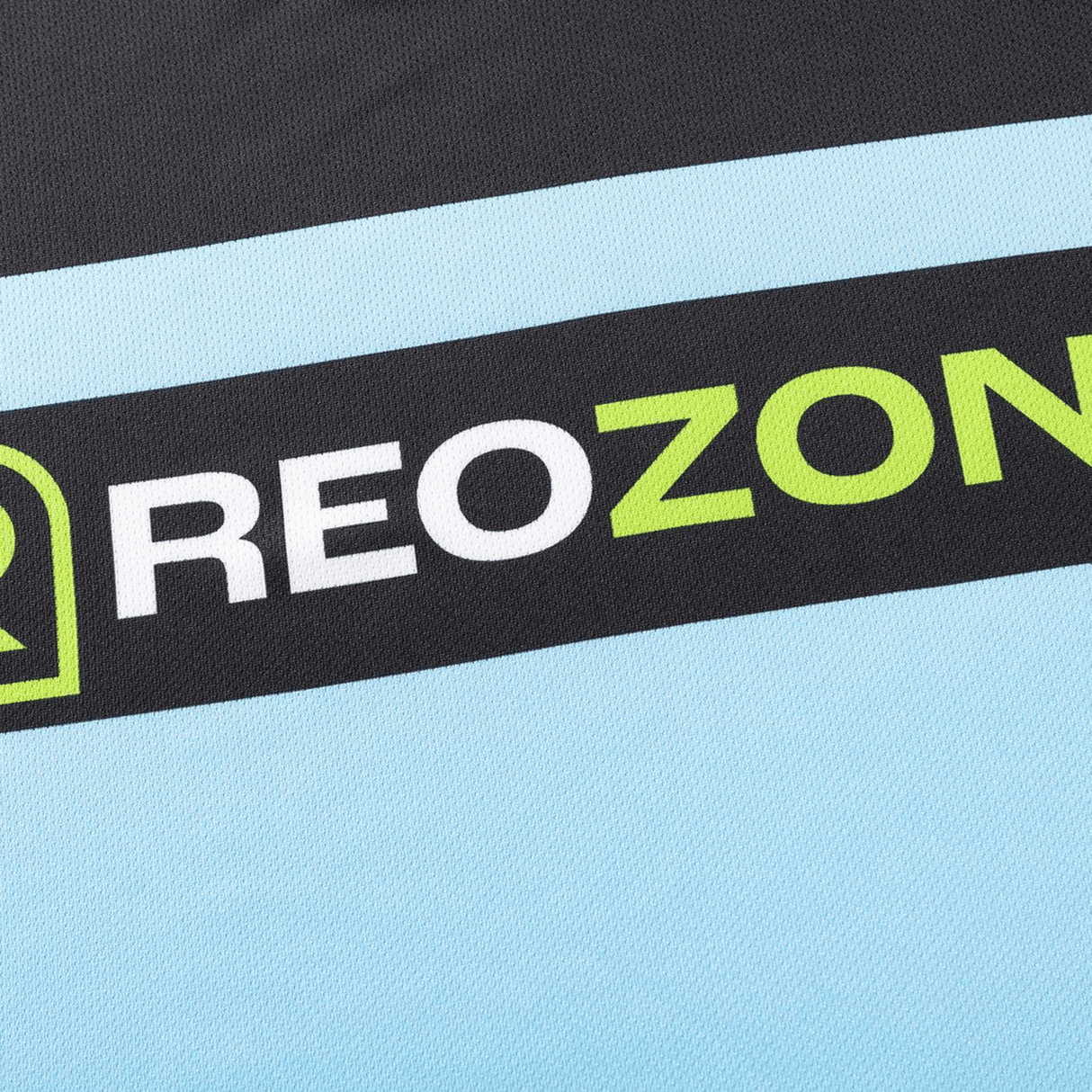 Close-up of the Sharks NRL 26/27 Replica Home Jersey by Classic Sportswear, showing "REOZONE" printed in white and green on a black and light blue background.
