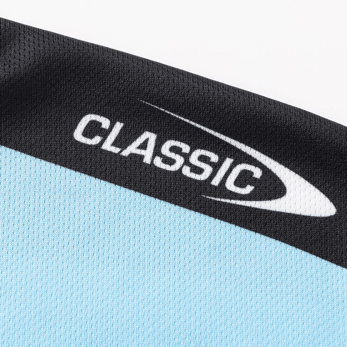 Close-up of the Sharks NRL 26/27 Replica Home Jersey by Classic Sportswear in light blue and black, with "CLASSIC" and a swoosh design printed in white.