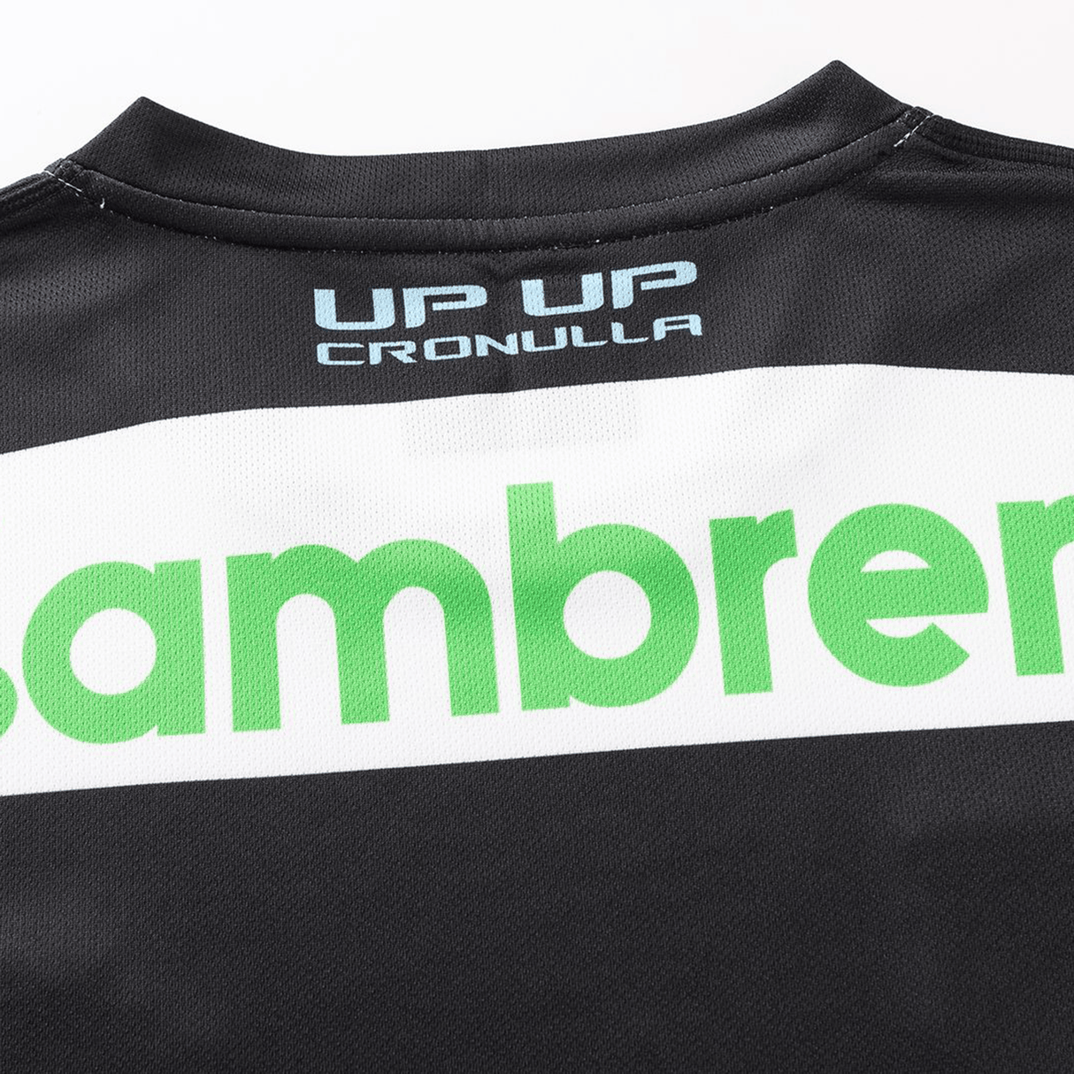 Close-up of the back of the Sharks NRL 26/27 Replica Home Jersey by Classic Sportswear, showing “UP UP CRONULLA” in white and blue above part of a green logo.