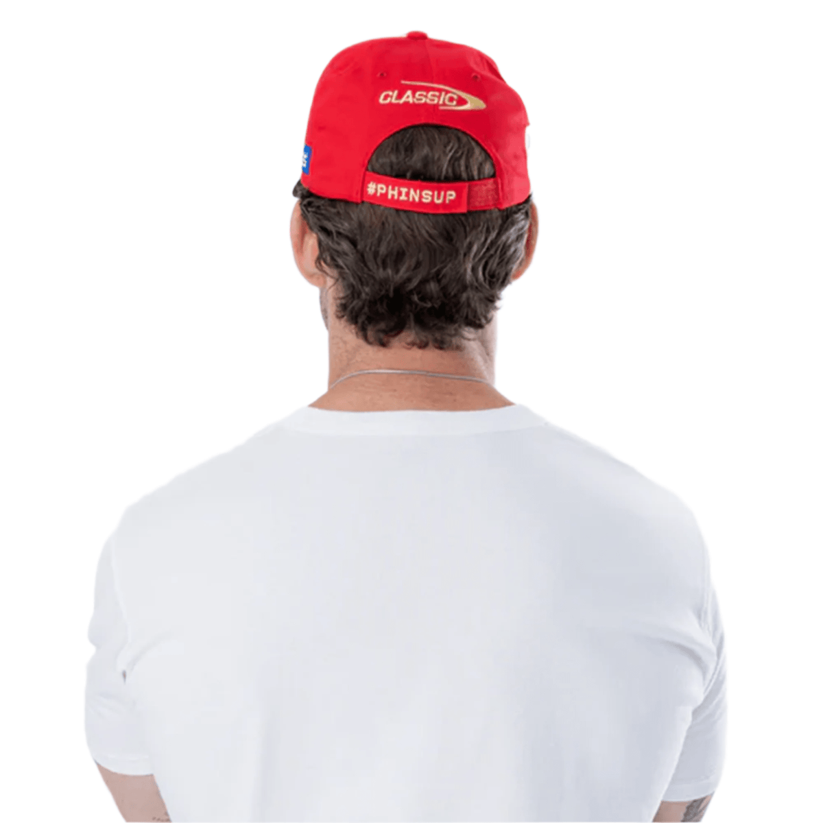 Back view of a person in a white shirt wearing the Dolphins NRL 25/26 Media Cap by Classic Sportswear, featuring "CLASSIC" and "#PHINSUP," displaying Classic Sportswear's signature style.