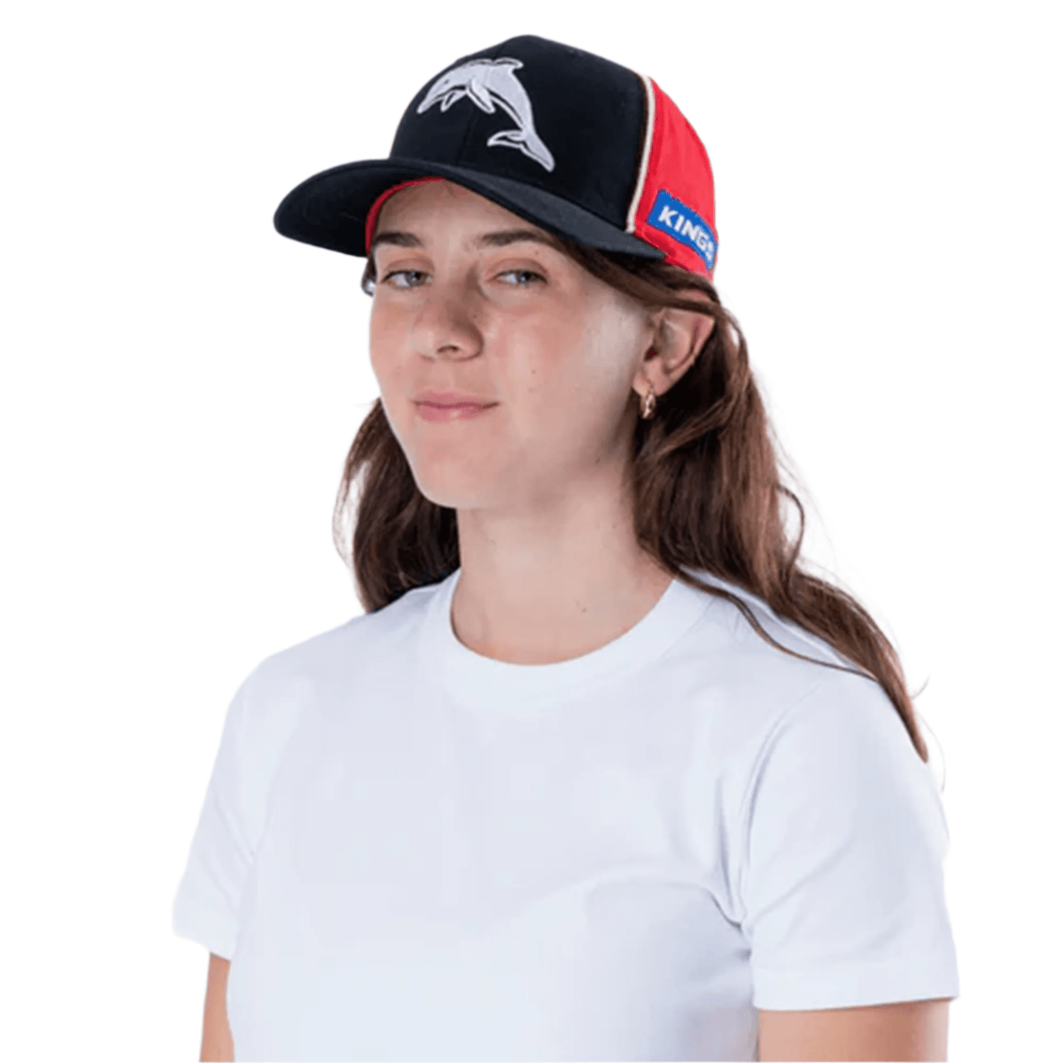 Someone in a white T-shirt wears a Dolphins NRL 25/26 Media Cap by Classic Sportswear, featuring an iconic dolphin logo in black and red.