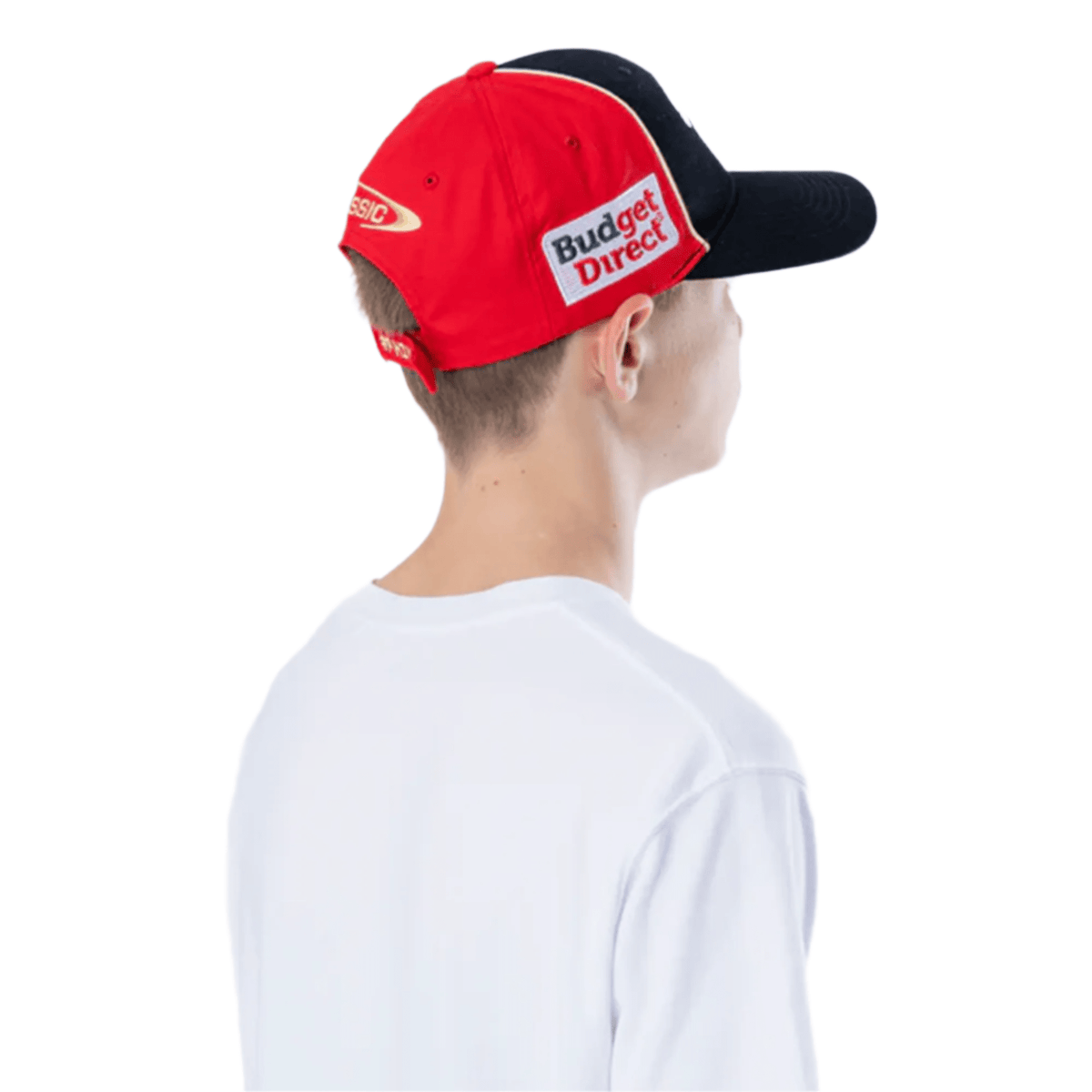 A person wearing the Dolphins NRL 25/26 Media Cap by Classic Sportswear, featuring "Budget Direct" text in red and black, is seen from behind in a white shirt.