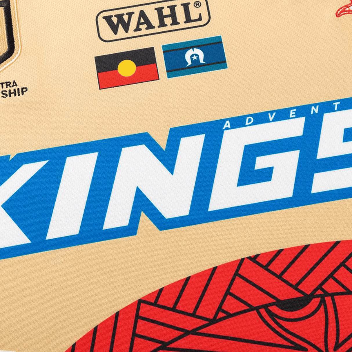 Close-up of the Dolphins Indigenous NRL 25/26 Replica Jersey by Classic Sportswear, featuring "KINGS," Indigenous and Torres Strait Islander flags, and sponsor logos—a standout choice for fans wanting a unique sports jersey.