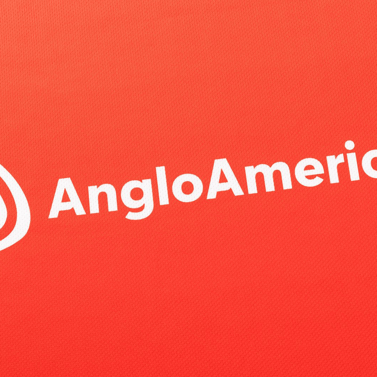 White "AngloAmerican" text and a white logo appear on a red background, matching the style of the Dolphins NRL 26/27 Replica Home Jersey by Classic Sportswear.