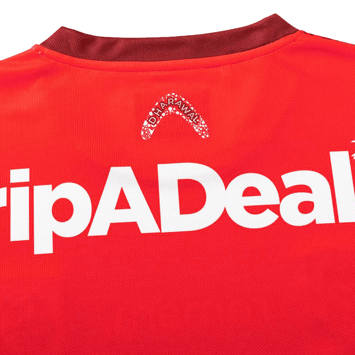 Close-up of the Dragons Indigenous NRL 25/26 Replica Jersey by Classic Sportswear, displaying a red design with white "TripADeal" and small "Alofa Rawali" logos near the collar.