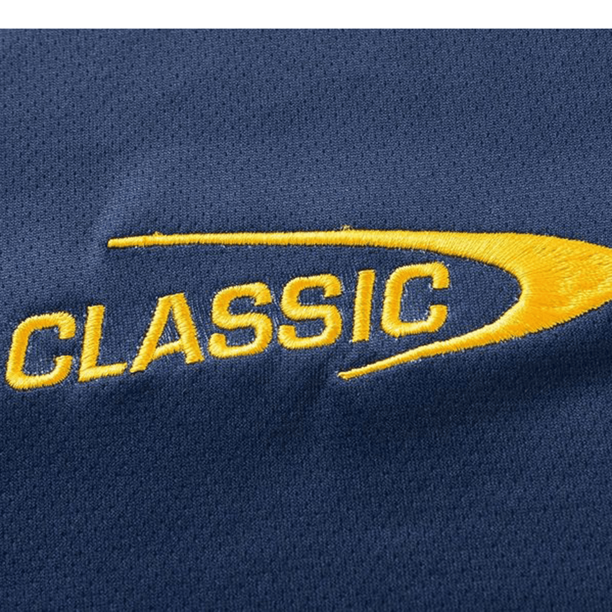 Close-up of a Highlanders Super Rugby Team Polo 25/26 by Classic Sportswear, featuring blue moisture-wicking fabric with "CLASSIC" embroidered in yellow next to a curved yellow design.