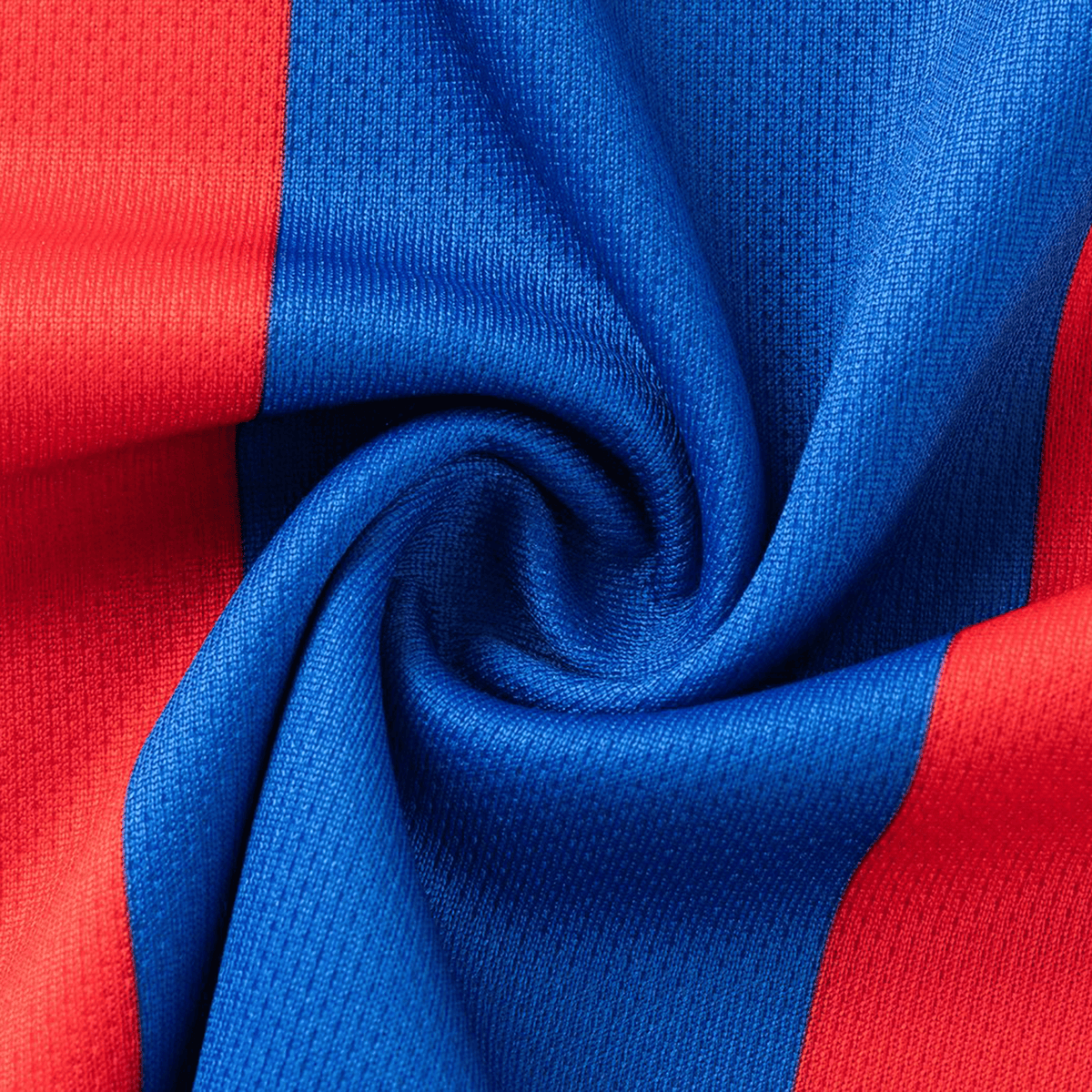 Close-up of red and blue textured fabric spiraled together, capturing the dynamic style of the Knights NRL 26/27 Replica Home Jersey by Classic Sportswear.
