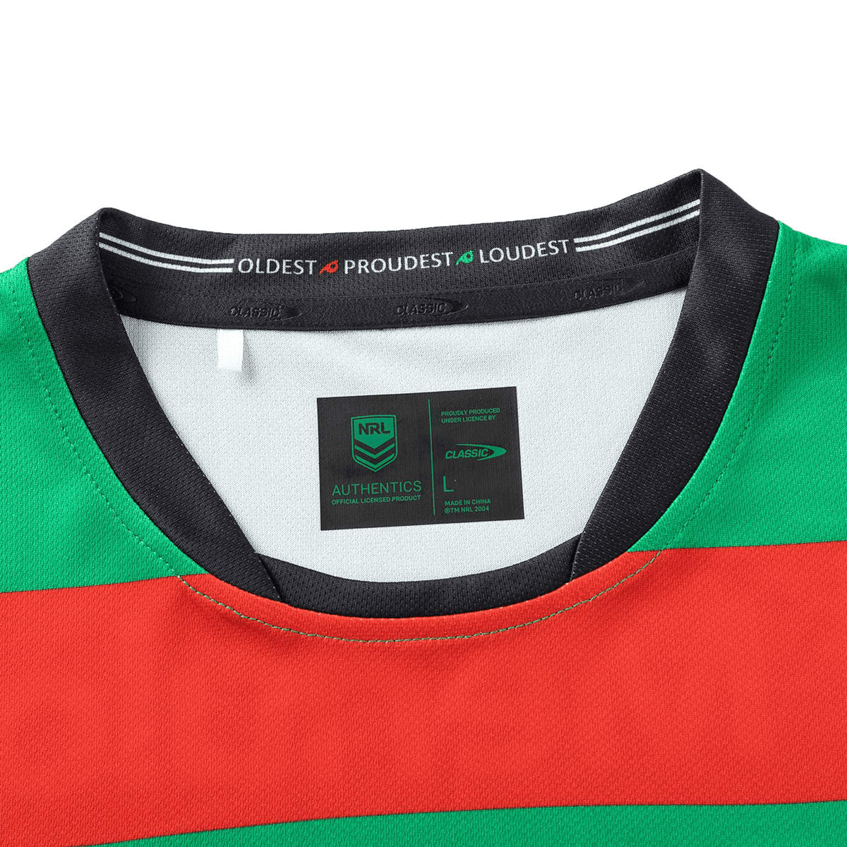 The Rabbitohs NRL 25/26 Replica Home Jersey, crafted by Classic Sportswear in size L, boasts a vibrant red, green, and black design with "OLDEST PROUDEST LOUDEST" inside the collar, capturing team spirit with style and authenticity.