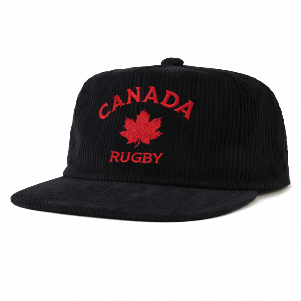 The EMB Weld Nations of Rugby Canada Corduroy Field Trip Cap is a black cap with "Canada Rugby" and a red maple leaf embroidered on the front, from the Nations of Rugby Collection.
