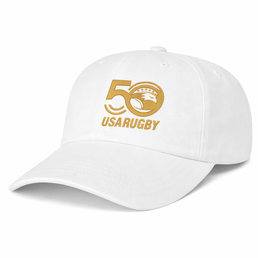 The EMB S&S Activewear USA Rugby 50th Anniversary Cotton Twill Dad Cap features a white design with a gold "50 USA Rugby" logo and eagle emblem on the front to celebrate 50 years of USA Rugby.