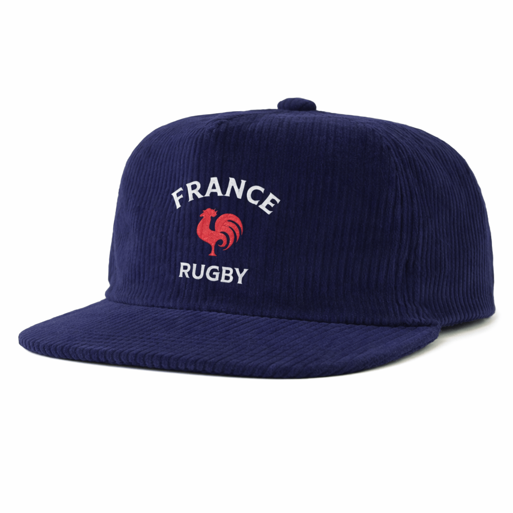 The EMB Weld Nations of Rugby France Corduroy Field Trip Cap is a navy blue flat-brim hat featuring "FRANCE RUGBY" and a red rooster embroidered on the front for an authentic vintage France rugby style.
