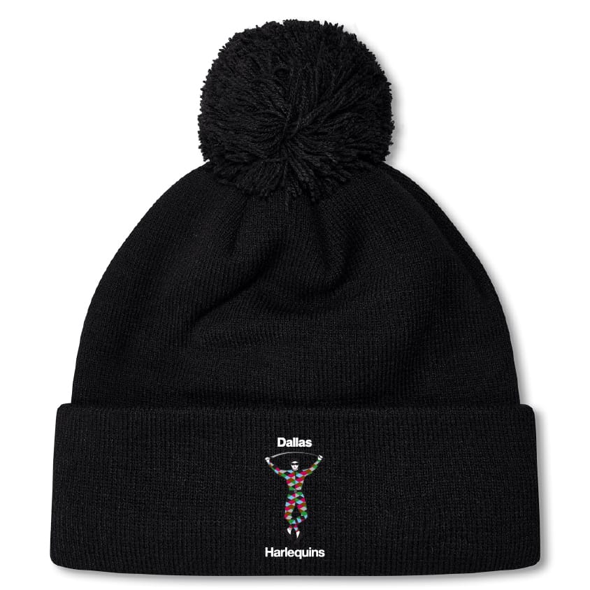 The Dallas Harlequins Pom Pom Beanie by EMB Canterbury features a black knit design with a colorful harlequin embroidery and "Dallas" above, "Harlequins" below—ideal for fans of the classic rugby bobble hat style.