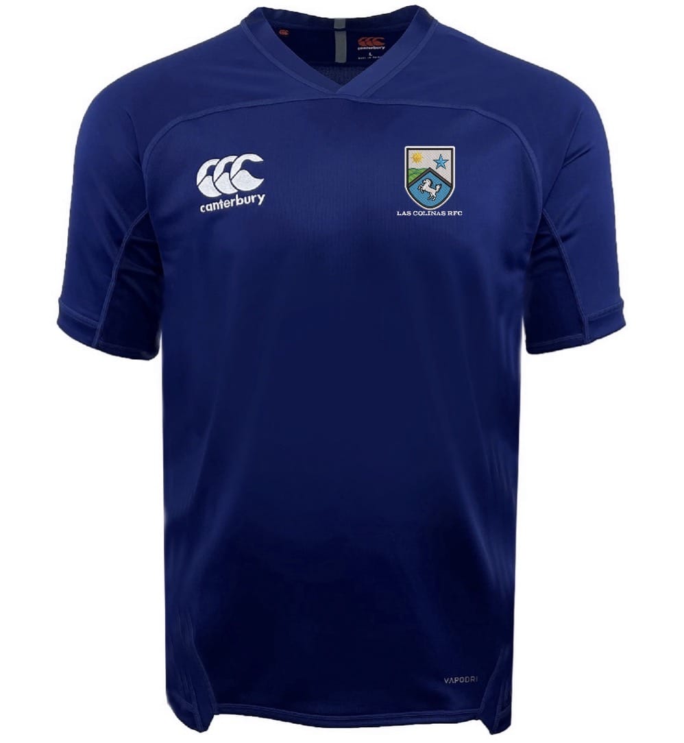 The Las Colinas Rugby Royal Vapodri Evader Jersey by EMB Canterbury is a blue short-sleeve top with the Canterbury logo, a bird and star crest on the chest, and Vapodri moisture-wicking tech to keep you cool on the rugby field.