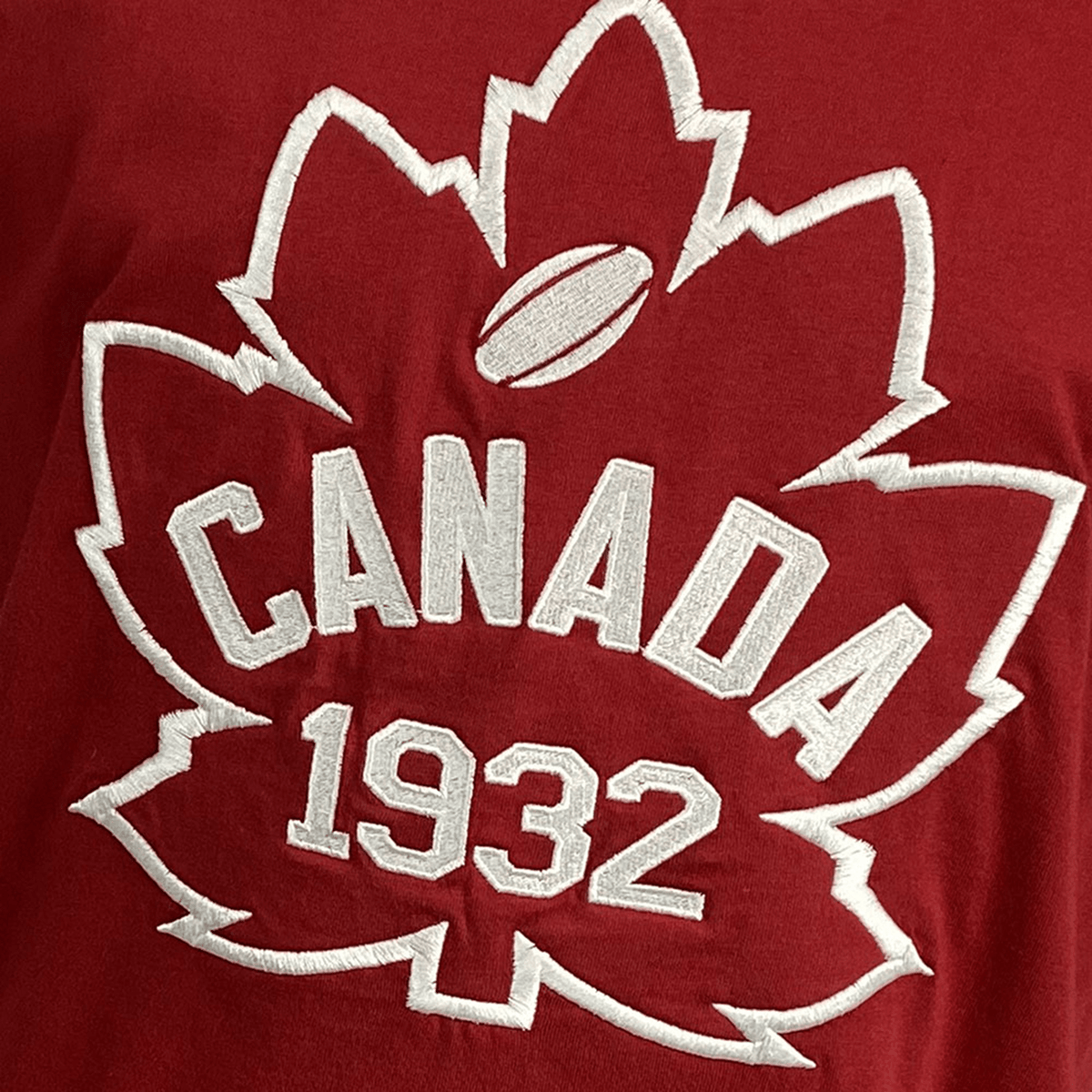The Ellis Rugby Canada Rugby 1932 T-Shirt in red features a white embroidered maple leaf, celebrating the brand's iconic heritage.