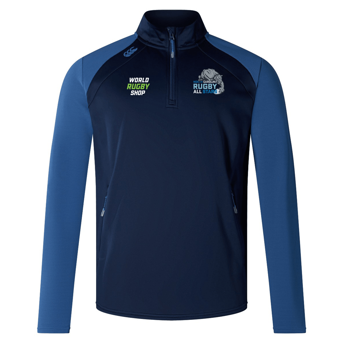 A navy blue and royal blue long-sleeve athletic jacket with a quarter-zip. The quick-drying top features "World Rugby Shop" and "Rugby All Stars" logos on the front, making it ideal rugby training attire with its advanced VapoDri technology.
The NC All Stars Elite First Layer by EMB Canterbury.