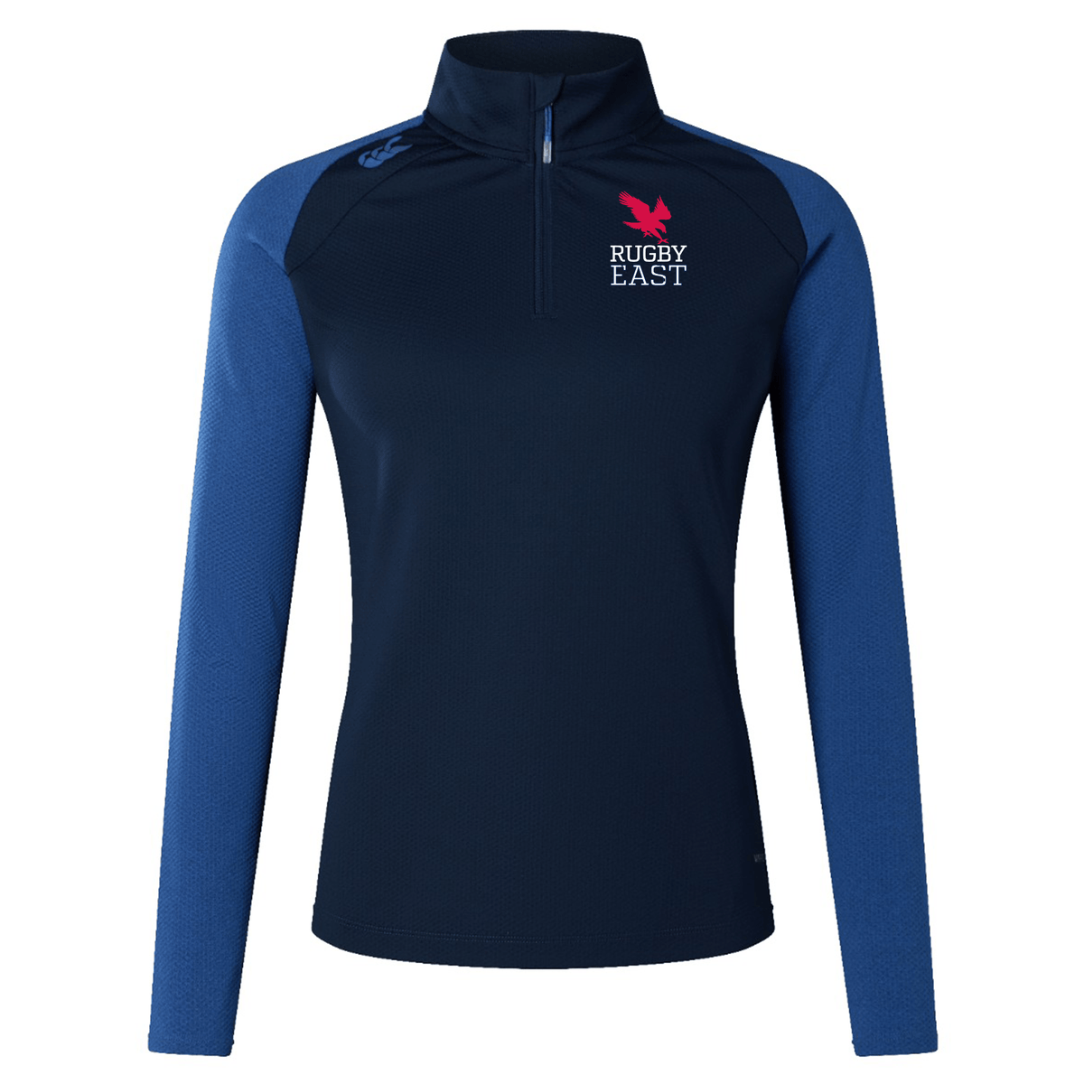 The Rugby East Conference Women's Elite First Layer by Canterbury, crafted from recycled polyester honeycomb fabric with VapoDri technology, features a blue half-zip and blue sleeves. Adorned with the Rugby East logo on the left chest.