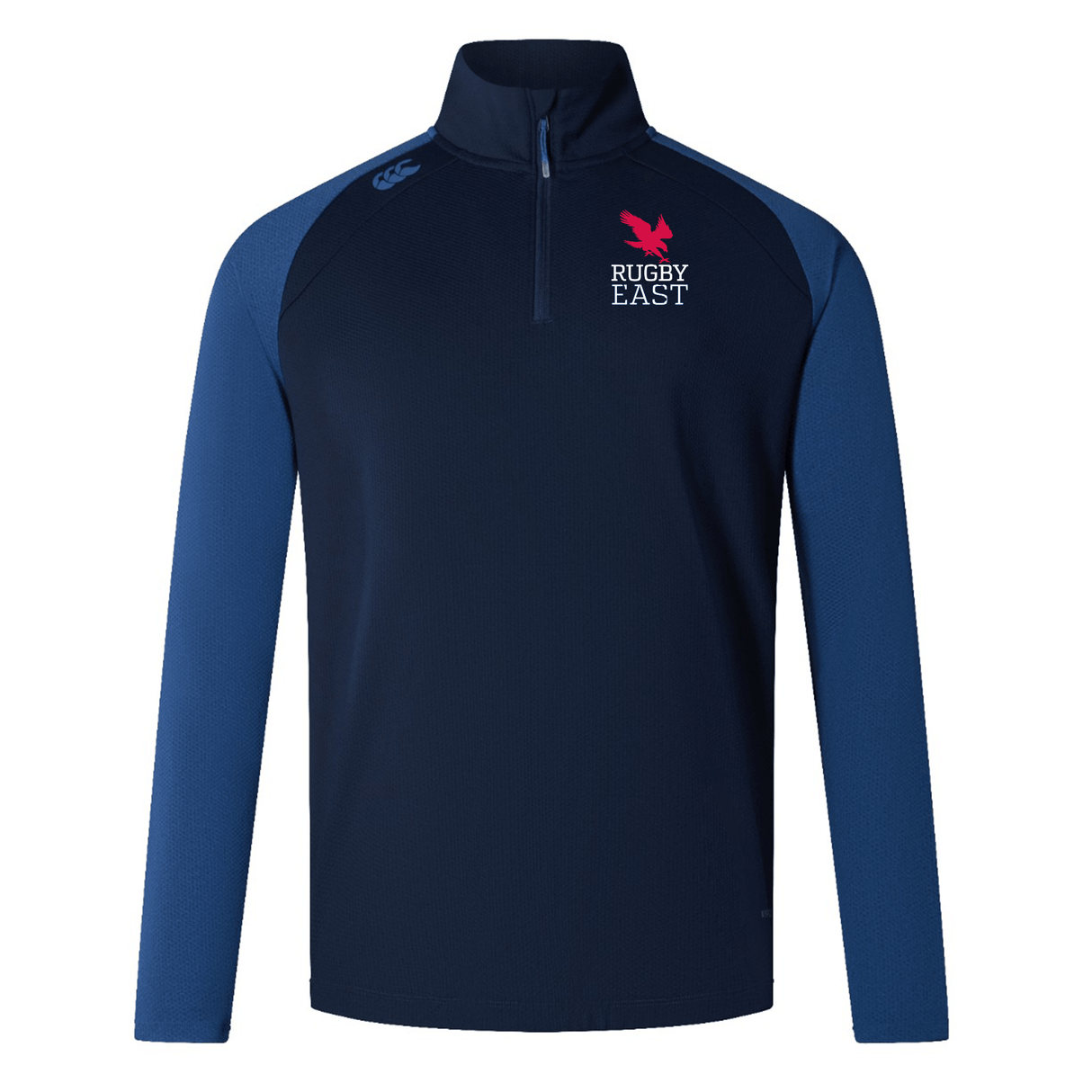 A navy and blue long-sleeve quarter-zip sweater featuring the "Rugby East" logo and a pink feather emblem on the upper left chest, along with a small white EMB Canterbury logo on the right shoulder. Ideal for training attire, this Rugby East Conference Elite First Layer by Canterbury incorporates VapoDri technology to keep you comfortable.
