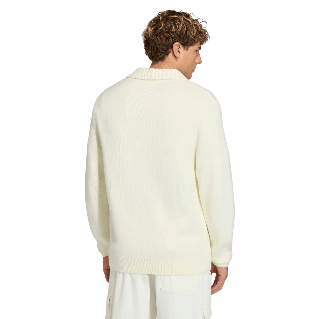 A man faces away, wearing the off-white France FFR 120 Year Cardigan by adidas with a shawl collar and matching pants, paying tribute to French rugby heritage against a plain background.