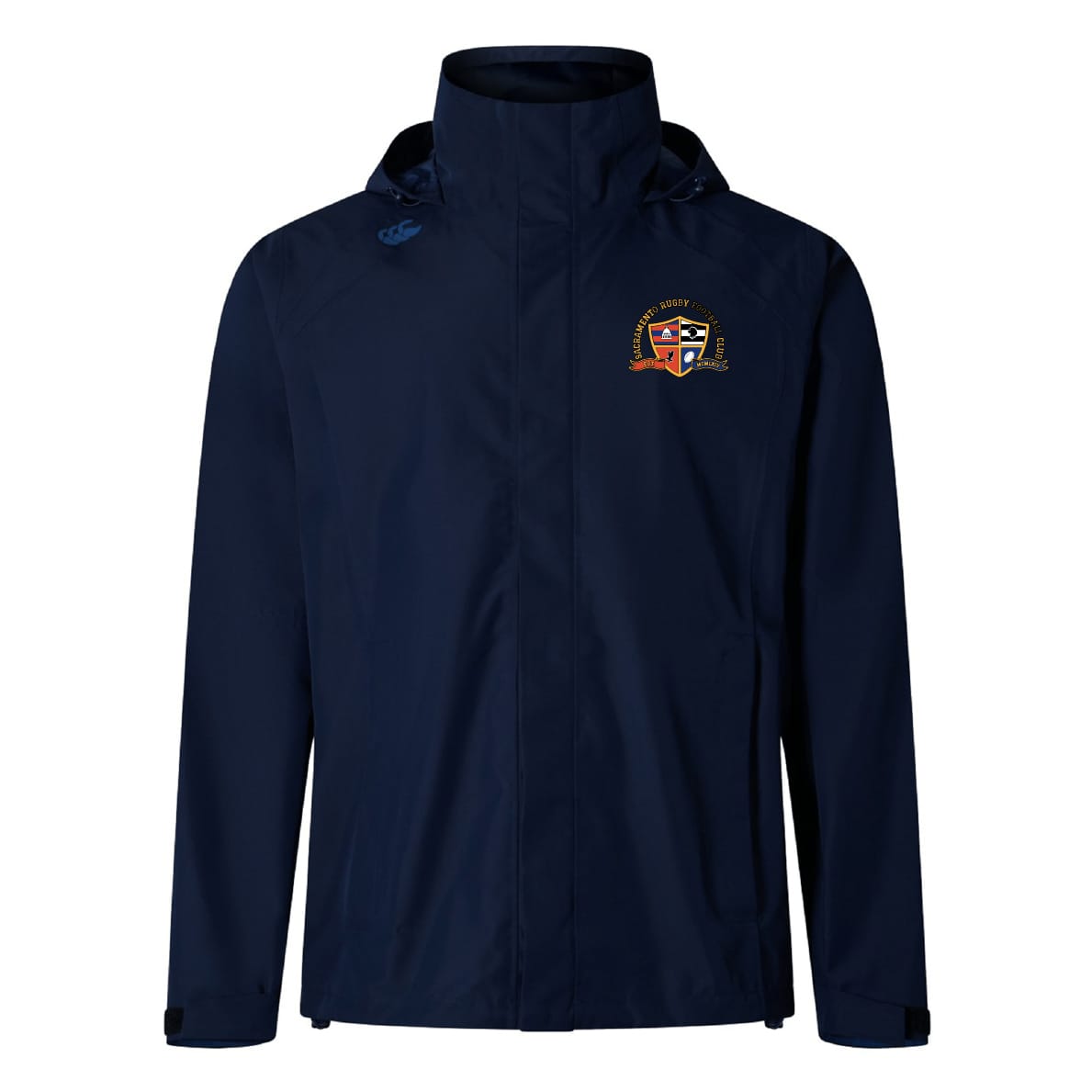 The EMB Canterbury Sacramento Rugby Football Club Elite Storm Jacket features a navy blue design, crest logo on the left chest, and a small blue symbol on the right shoulder. This breathable jacket offers comfort and style for any occasion.