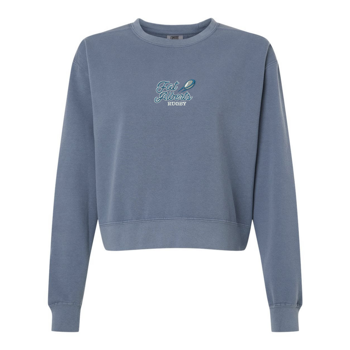 The EMB S&S Activewear Women's Gulf Coast Fat Alberts Rugby Mid-Length Crewneck Sweatshirt is a blue, relaxed-fit, garment-dyed top with "Fat Albert's Rugby" and a rugby ball graphic for comfort and vintage-inspired style.