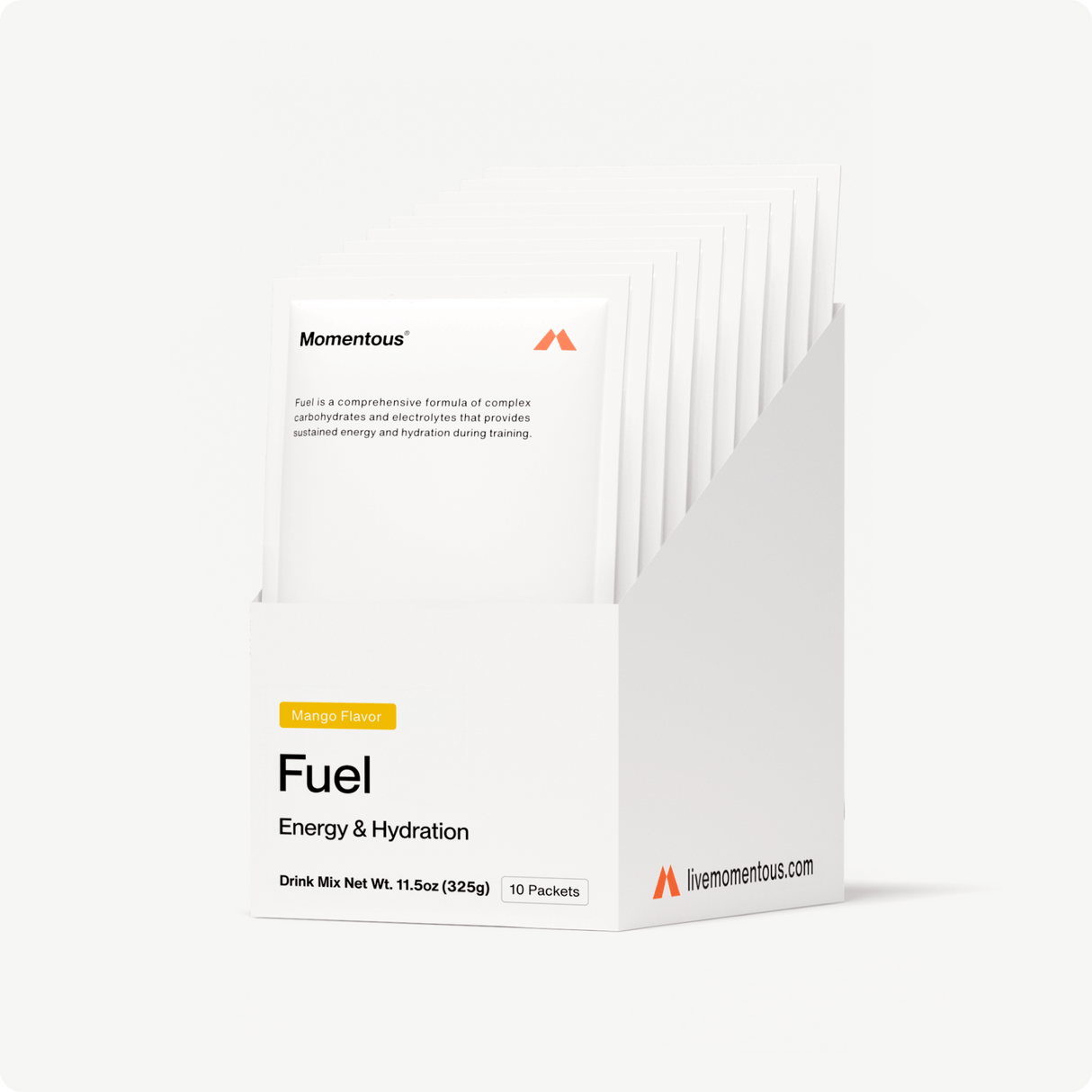 A white box labeled Momentous Fuel 10-Travel Packs contains ten mango-flavored carb-electrolyte drink mix packets for sustained energy during endurance exercise. The brand Momentous and website info appear on the box.