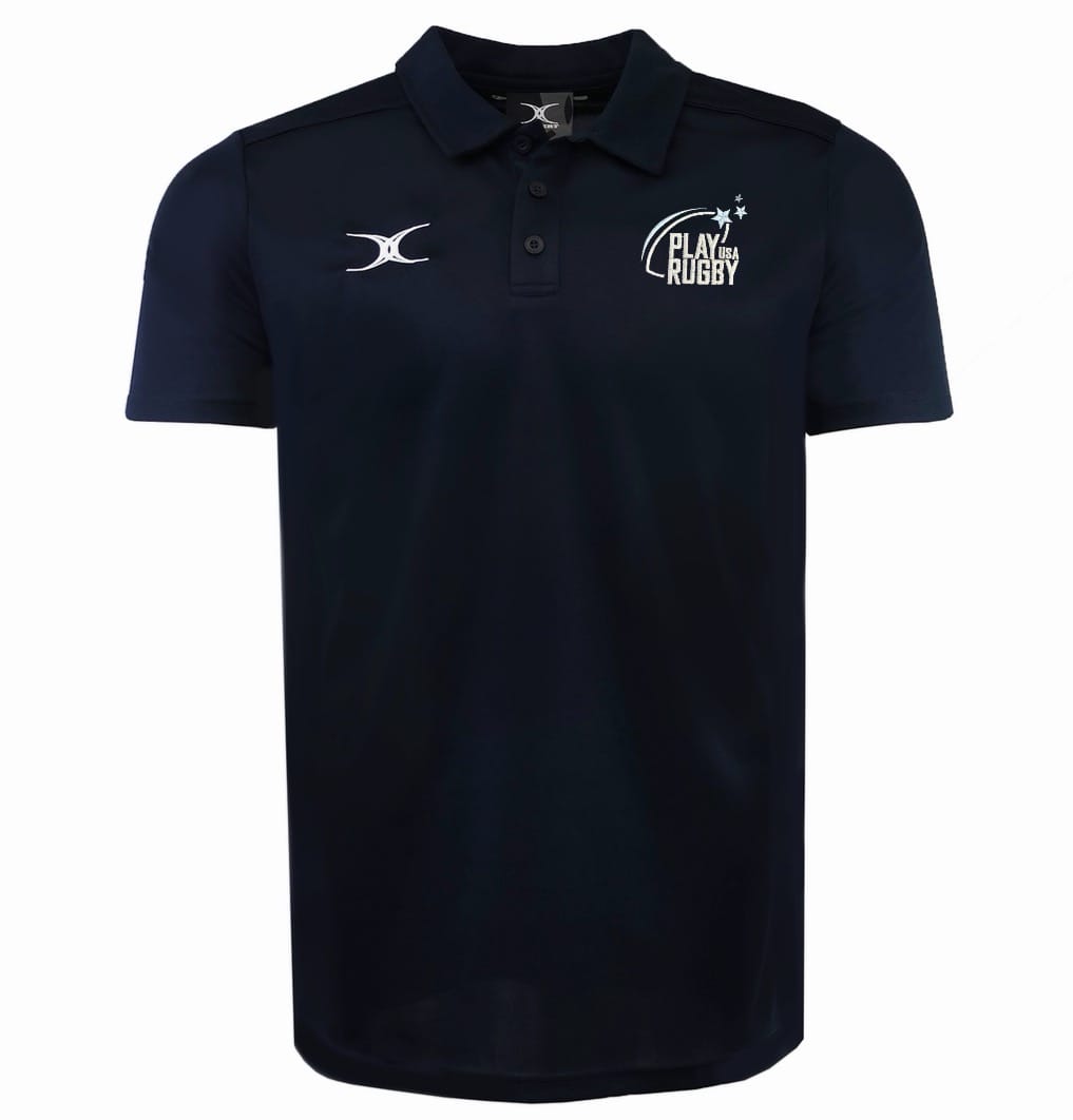 The Play Rugby USA Photon II Polo by EMB Gilbert is a navy blue athletic polo with a collar, button placket, "PLAY RUGBY" left chest logo, and a white swoosh logo on the right chest for a classic rugby look.
