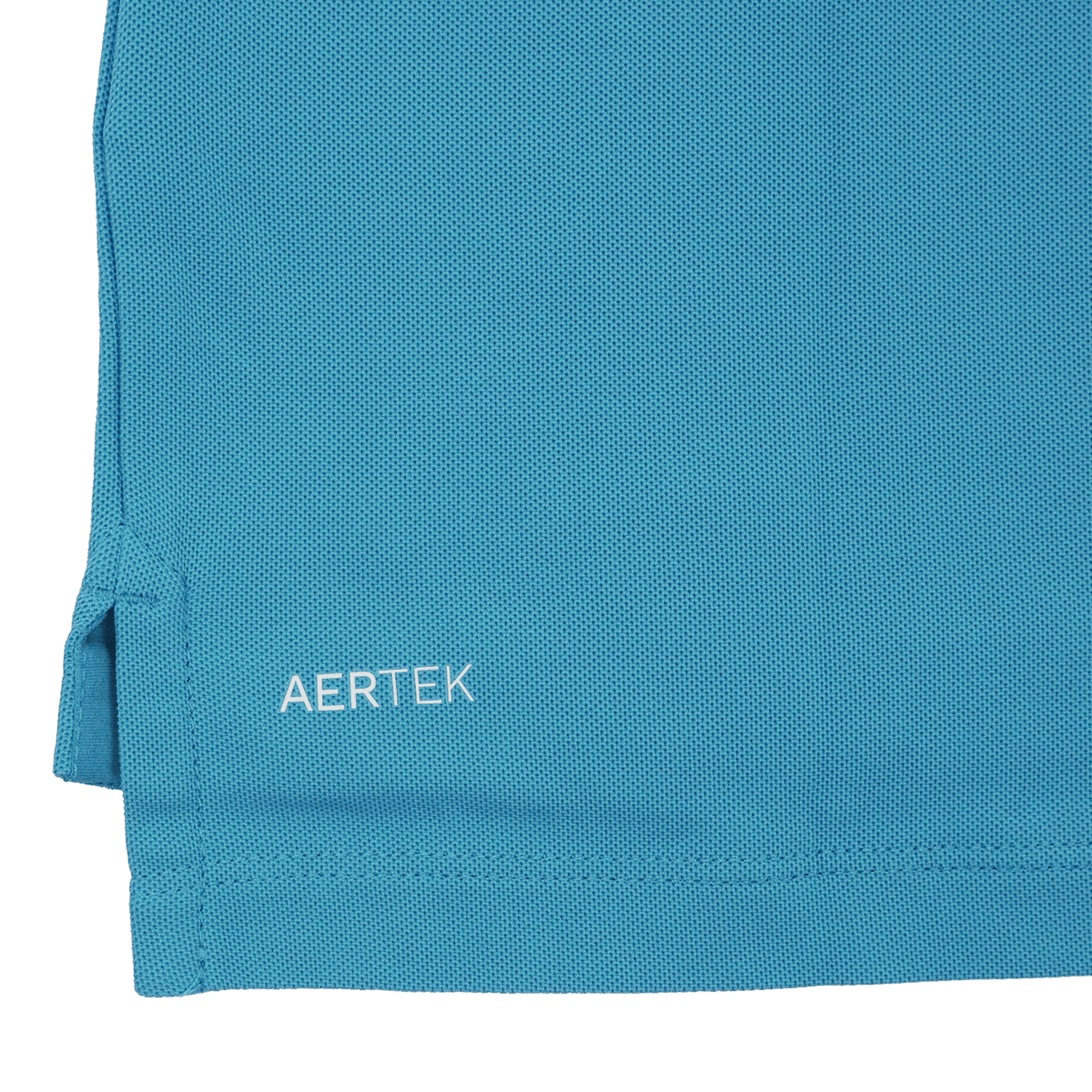 Close-up of the hem of a blue Leinster 24/25 Club Essential Polo by Castore, featuring the brand name "CASTORE" printed in white letters near the bottom edge.