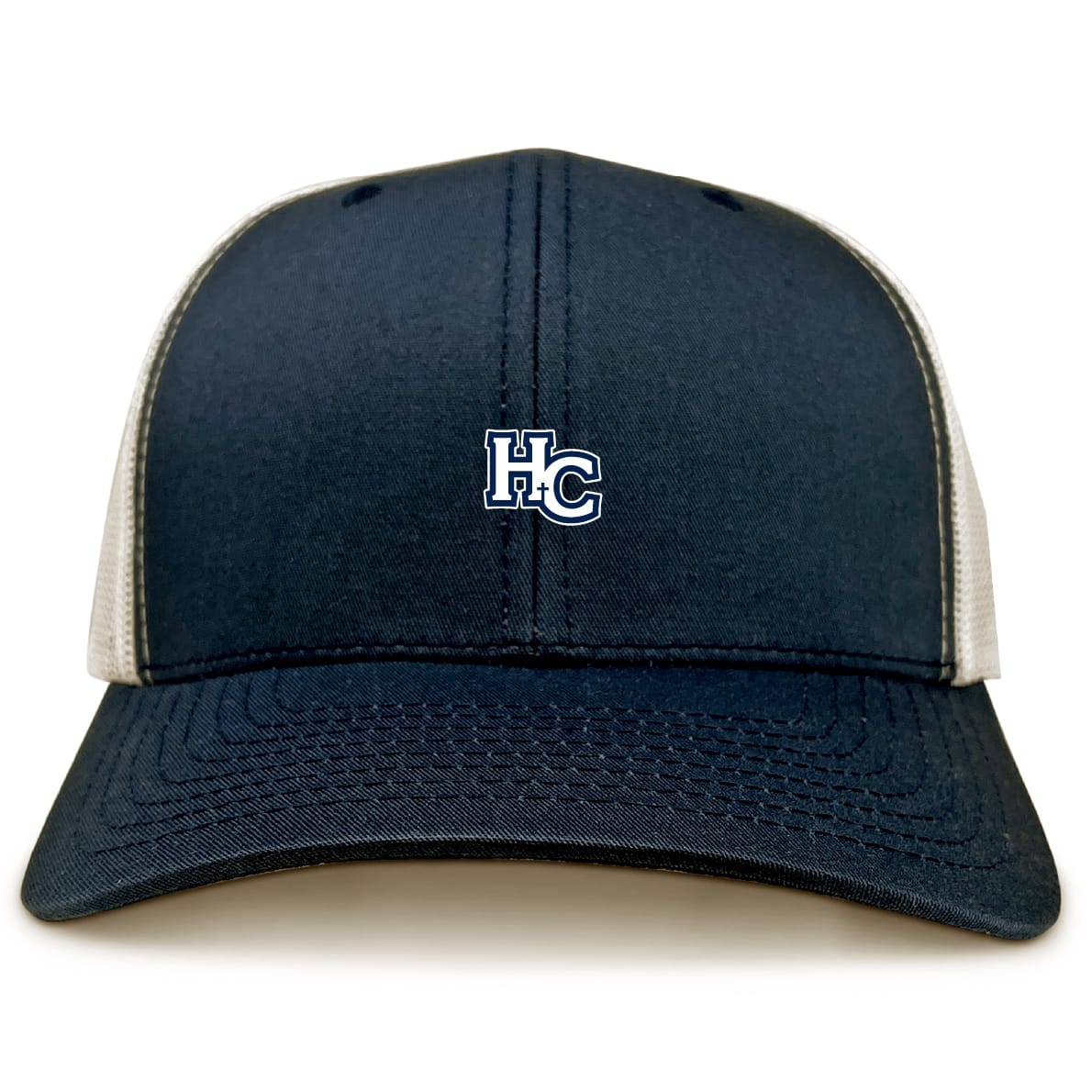 The EMB S&S Activewear Holy Cross Retro Trucker Cap features a navy blue and white design, an embroidered "HC" on the front, and a snapback closure.