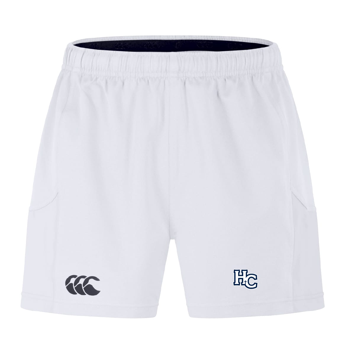 The EMB Canterbury Holy Cross Advantage Short 2.0 features white performance fabric, an elastic waistband, a black Canterbury logo on the left leg, and a blue and white "HC" logo on the right—ideal for athletes seeking comfort and style.