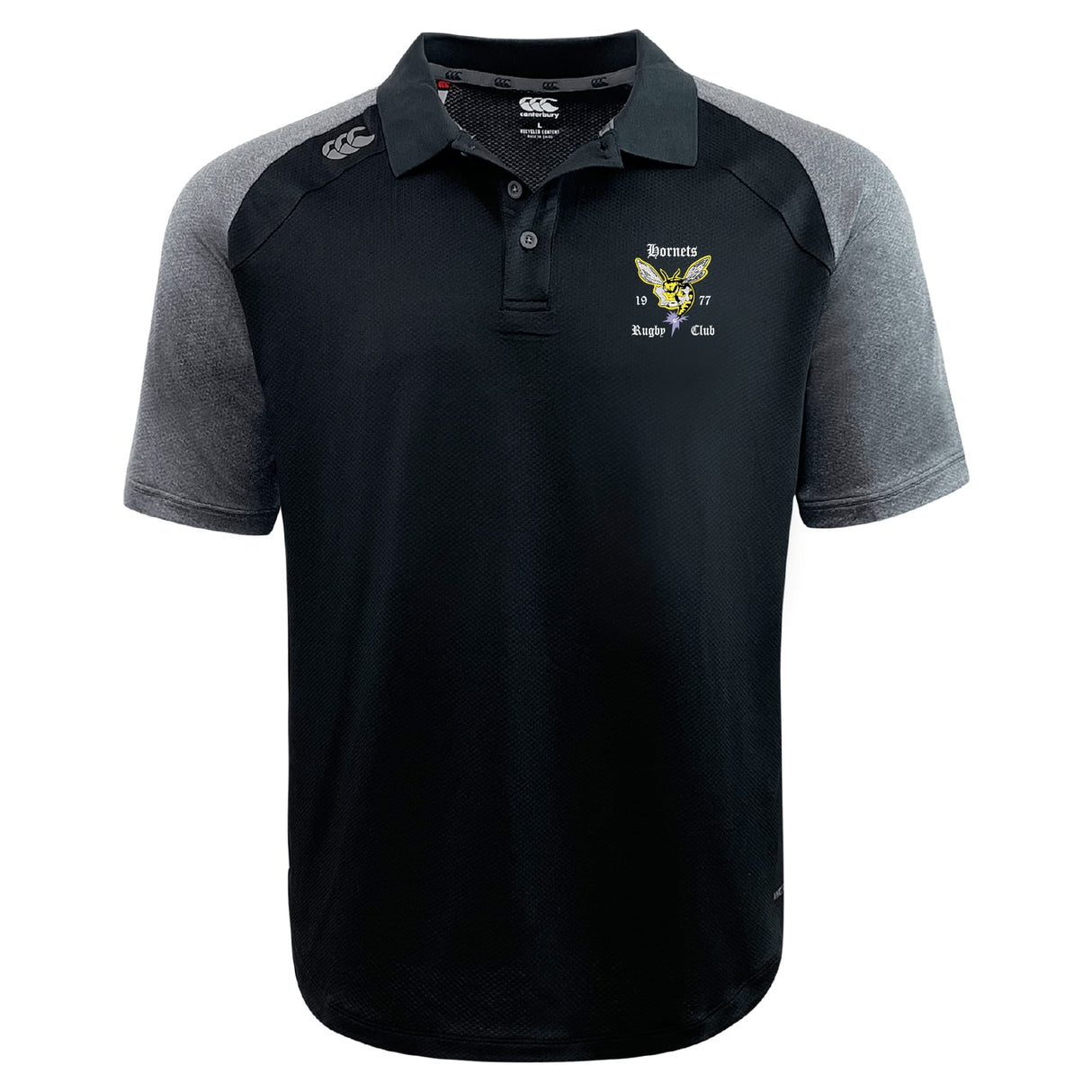 The Hornets Rugby Club Elite Polo by EMB Canterbury is a black and gray lightweight polo with a collar, button placket, Vapodri fabric, and an embroidered "Hornets Rugby Club 1977" logo on the left chest.