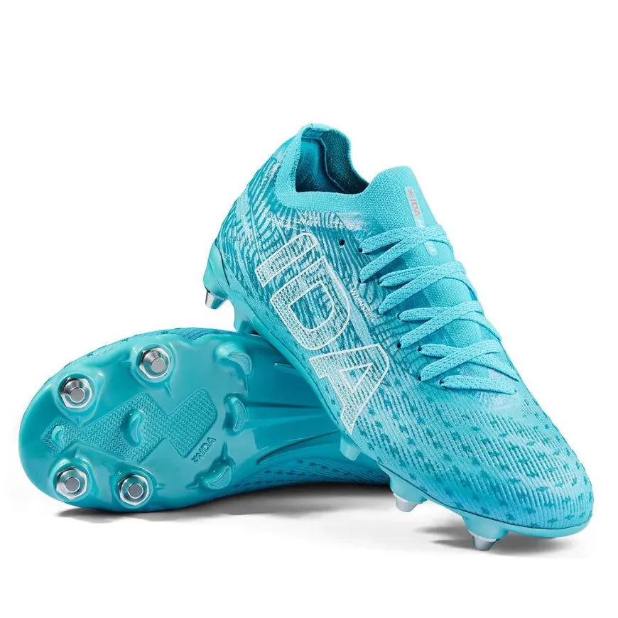 A pair of IDA Sports Ida Women's Helia Pro SG - Blue soccer cleats, with one shoe upright and the other on its side to display the studs—ideal pro performance footwear for women playing on wet and muddy fields.