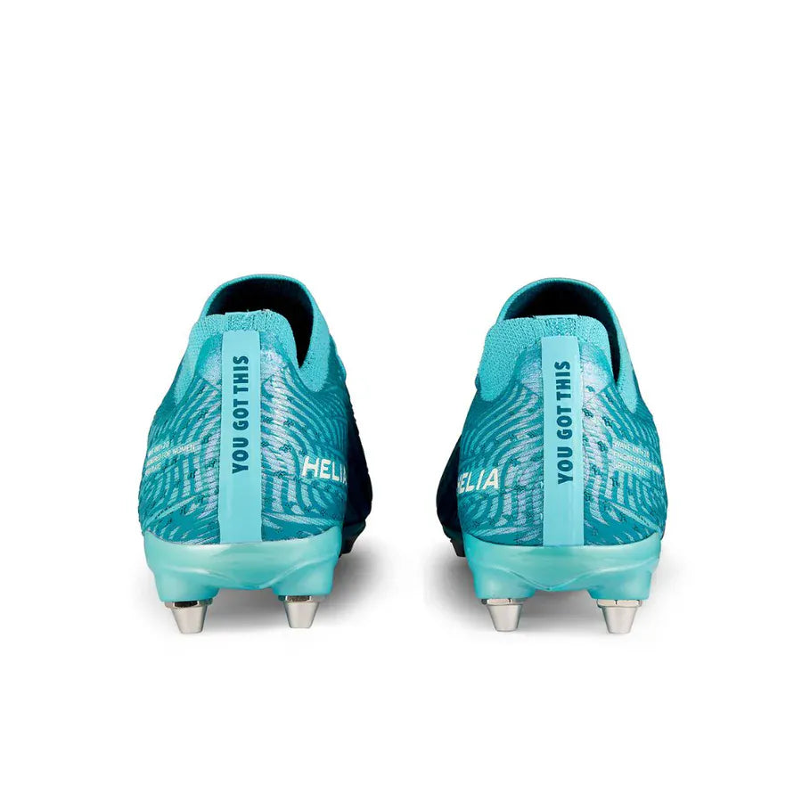The IDA Sports Ida Women's Helia Pro SG - Blue soccer cleats, shown from the back, feature "YOU GOT THIS" on the heel tabs and metallic studs for pro performance—ideal for wet and muddy fields.