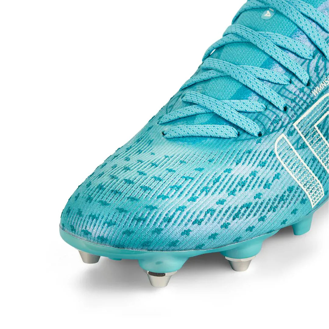 Close-up of the IDA Sports Ida Women's Helia Pro SG - Blue soccer cleat, featuring laces, metallic studs, and textured upper—ideal for pro performance on wet, muddy fields.
