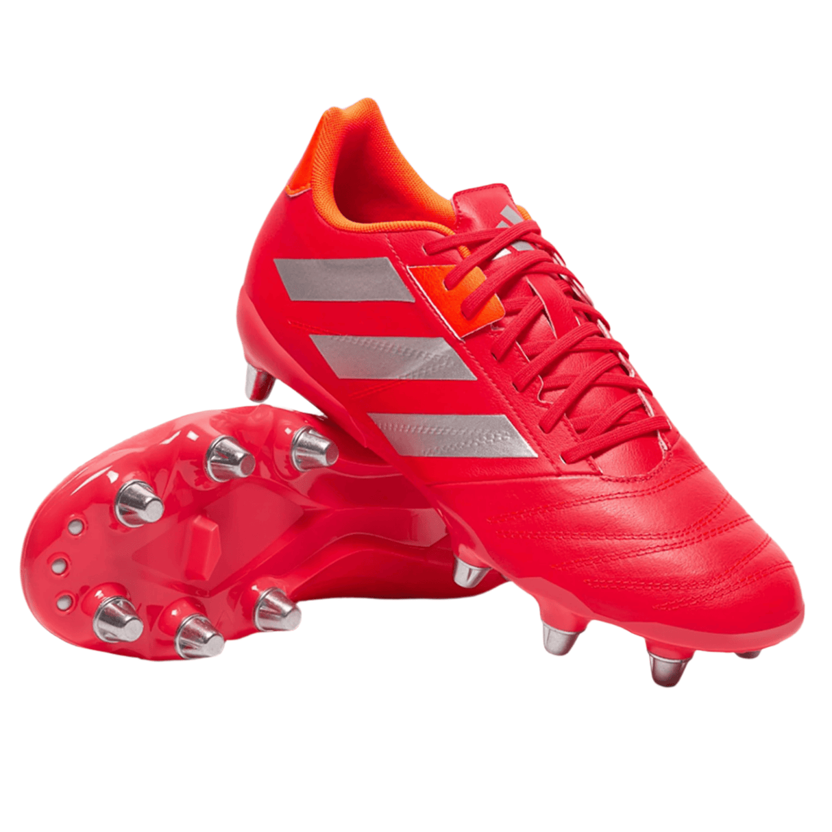 The adidas Kakari Elite SG cleats in Lucid Red/White/Team Solar Orange, featuring metal studs and a unique soft ground cleat configuration, are shown—one upright and one on its side—against a plain white background.