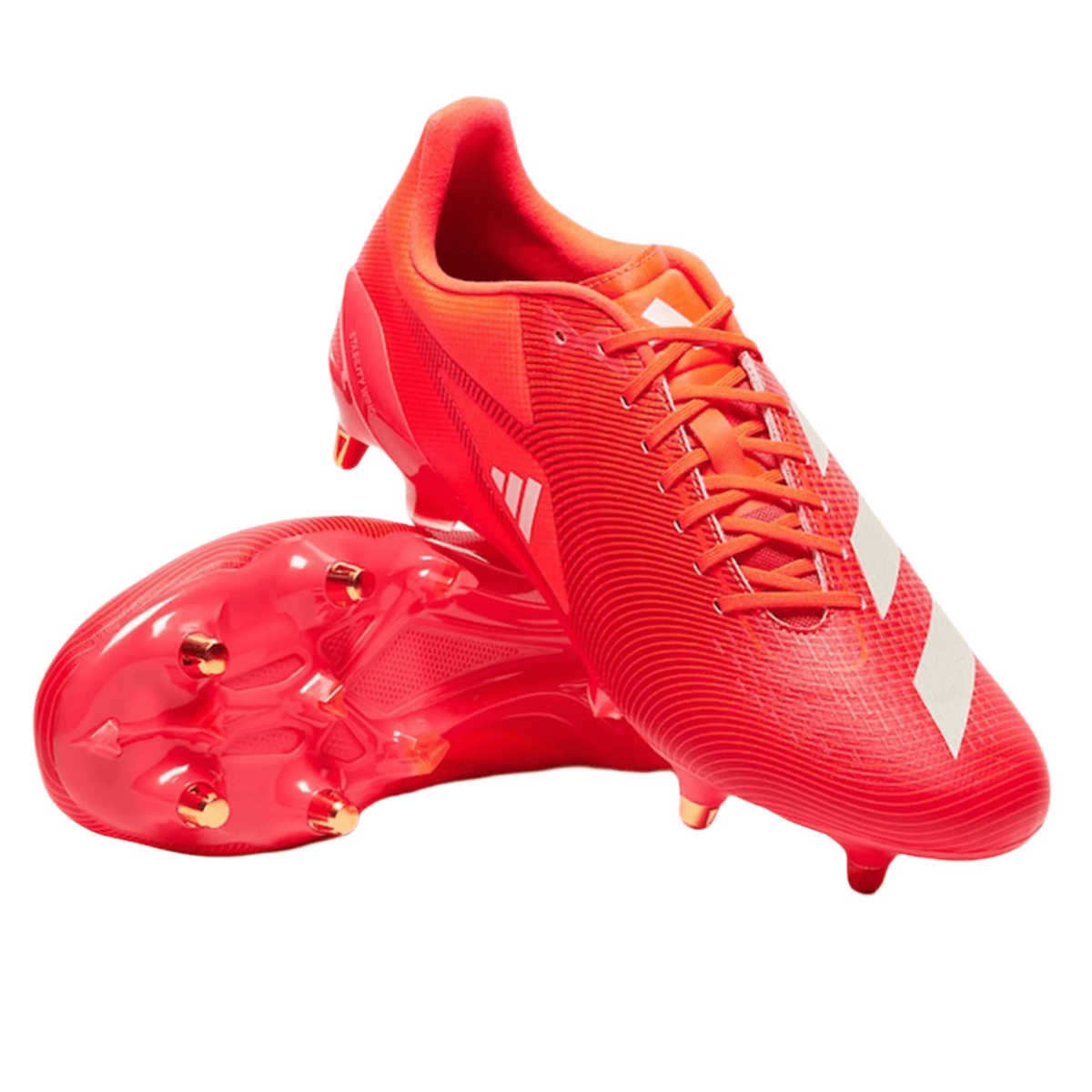 A pair of adidas Adizero RS15 Pro SG rugby boots in Lucid Red, White, and Team Solar Orange for soft ground—one boot standing upright and the other lying on its side—isolated on a white background.