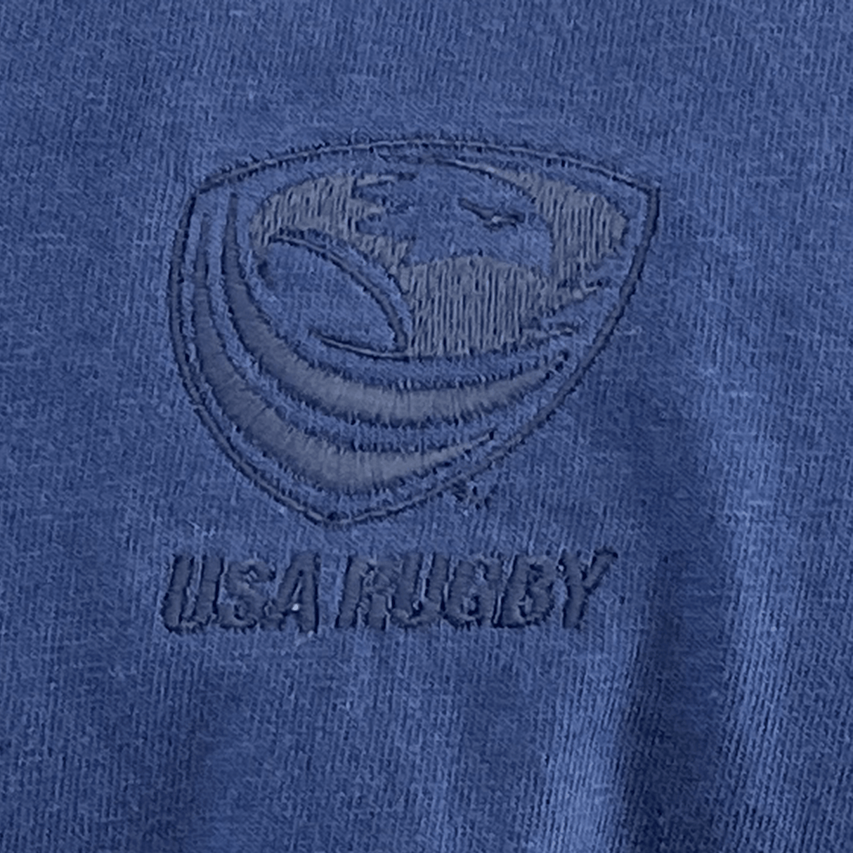 Close-up of the EMB S&S Activewear USA Rugby Elevated Tonal Comfort Tee - Navy, crafted from 100% ring-spun USA cotton, featuring an embroidered USA Rugby logo and "USA RUGBY" text for standout comfort and style.
