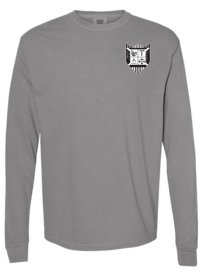 The Troy Rugby Long Sleeve Comfort Tee by EMB S&S Activewear is a gray shirt with a black and white shield emblem featuring embroidered symbols and letters on the left chest.