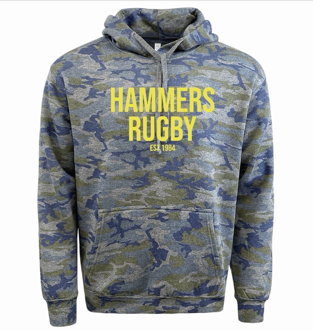 The Montgomery Yellowhammers "Hammers Rugby" camo fleece hoodie by WRS LAT features blue and green camo with yellow "HAMMERS RUGBY EST. 1984" text—a bold choice for fans.