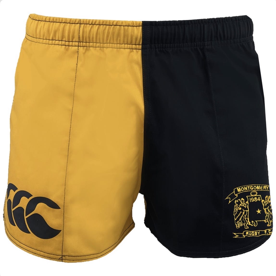 The Montgomery Yellowhammers Retro Classic Harlequin Cotton Short by EMB Canterbury features two-tone legs—one yellow, one black—with a crest and "Montgomery Rugby" on the black side, Canterbury logo on the yellow, and durable cotton construction.