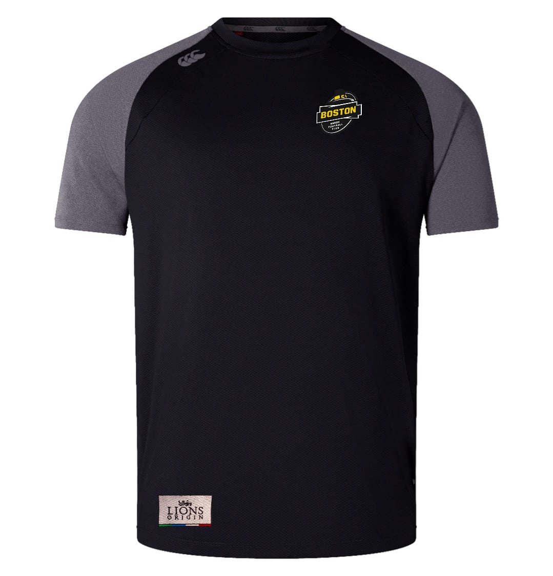 The EMB Canterbury Boston RFC Lions Origin Elite Training Tee is a lightweight, durable black and gray athletic shirt with a Boston rugby logo on the chest, Lions Origin badge near the hem, and crafted from Vapodri fabric for superior comfort.