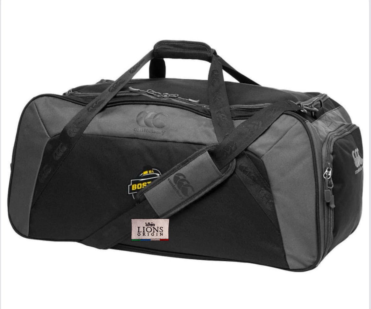 The Boston RFC Lions Origin Holdall Duffle Bag by EMB Canterbury features water-repellent black and gray fabric, both hand and shoulder straps, and displays "BOST" and "LIONS ORIGIN" logos—ideal for your rugby gear.