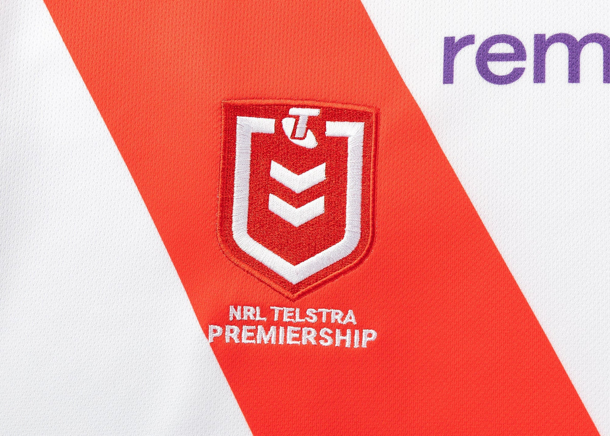 The Dragons NRL 25/26 Replica Home Jersey by Classic Sportswear showcases the iconic NRL Telstra Premiership logo on a vibrant sports jersey with a striking red diagonal stripe.
