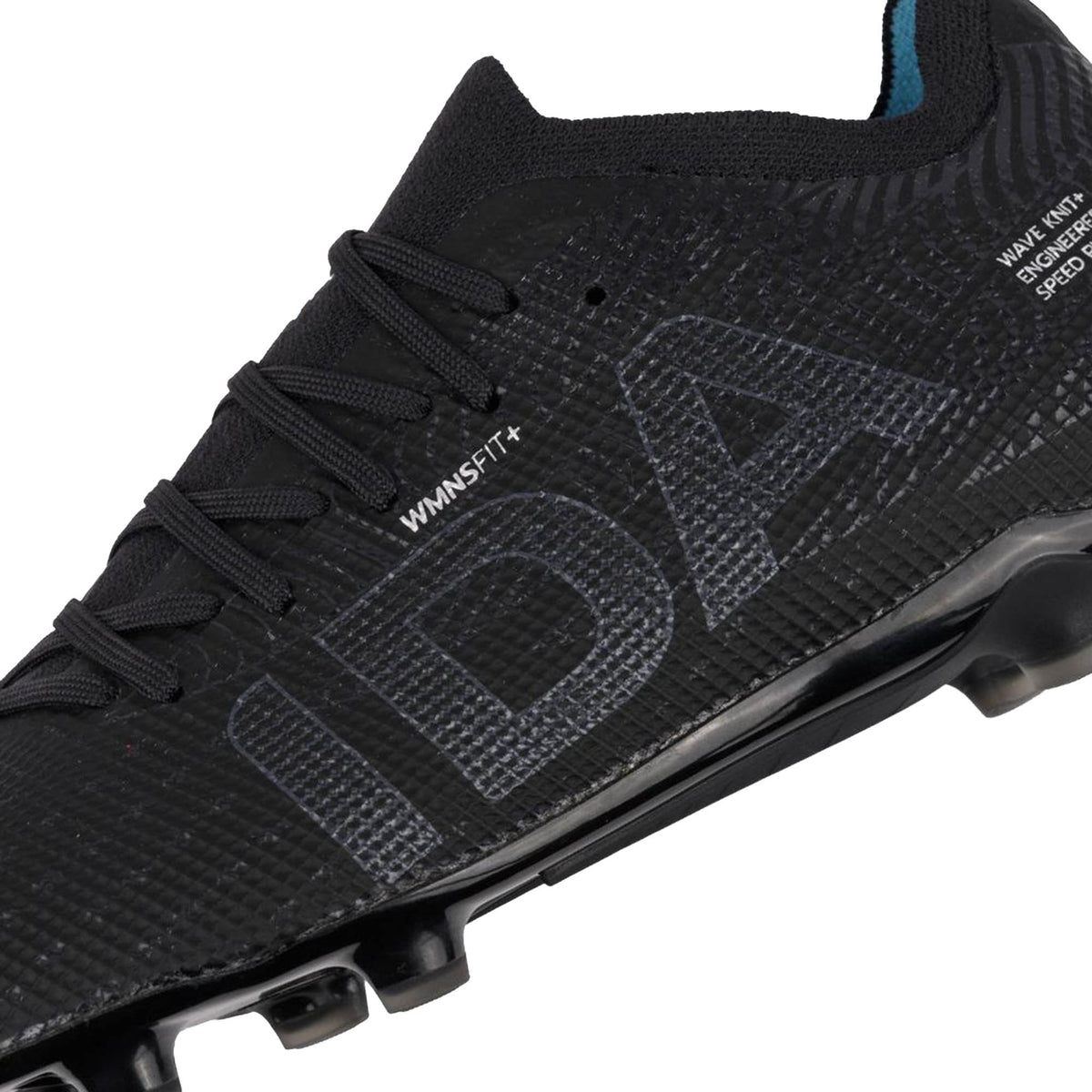 Close-up of the IDA Helia Elite FG/AG women’s soccer cleat by IDA Sports in Black/Dark Grey, featuring “IDA” in large letters on the side and textured detailing across the upper surface, highlighting its women-specific design.