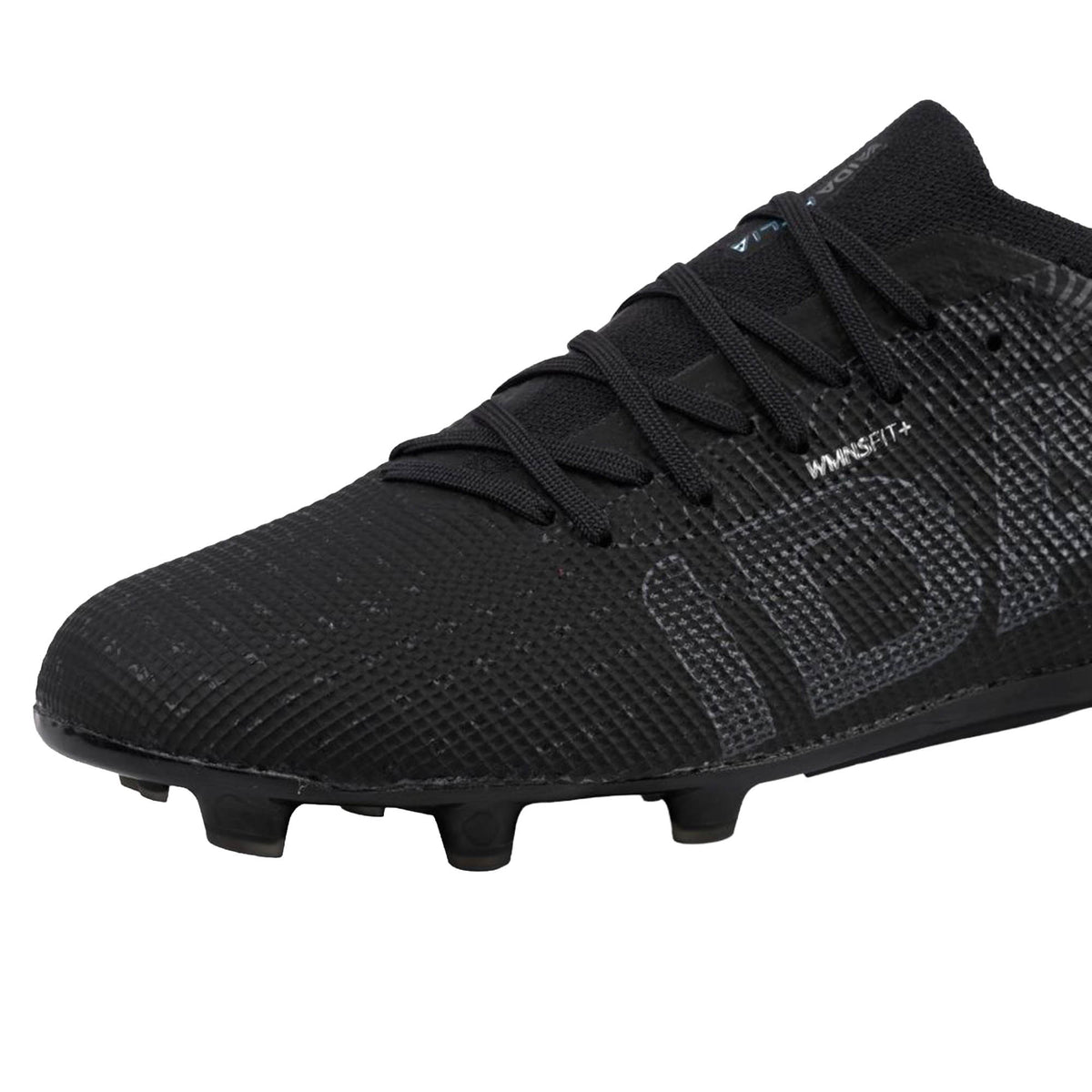 A close-up of the IDA Sports IDA Helia Elite FG/AG - Black/Dark Grey soccer cleat showcases its textured upper, black laces, and TPU studs on the outsole, designed for firm ground play. This women’s soccer cleat features a women-specific design to enhance fit and performance.