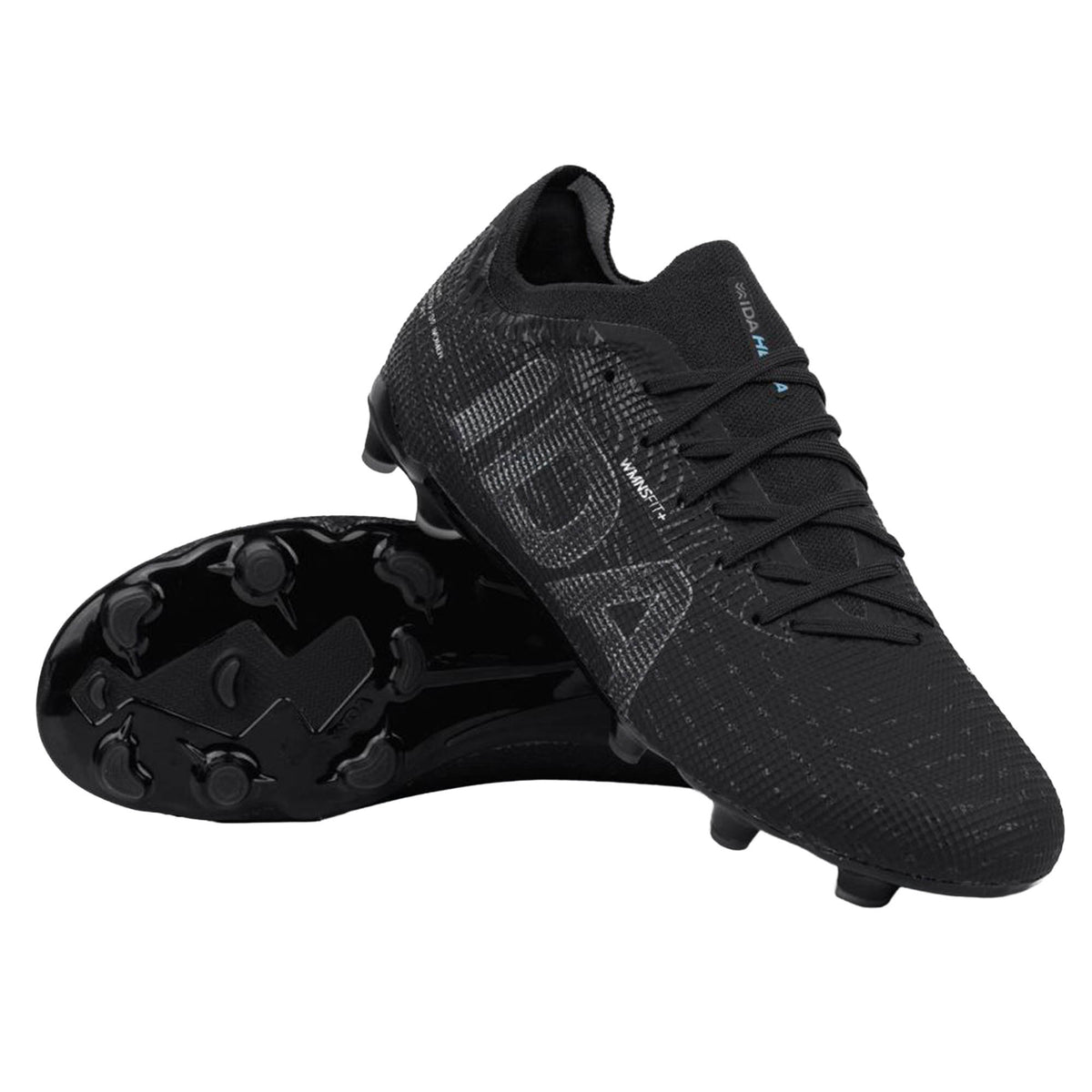 The IDA Sports IDA Helia Elite FG/AG - Black/Dark Grey is a pair of elite soccer cleats designed specifically for women, featuring textured black uppers with subtle branding, molded studs for firm ground and artificial grass play, and a low-cut silhouette, displayed on a white background.