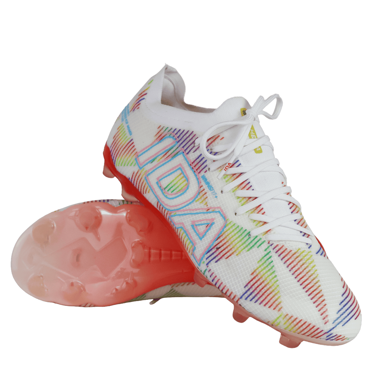 A pair of IDA Sports Helia Elite Limited Edition Pride FG women's soccer cleats in white, with multicolored geometric patterns, "IDA" branding on the side, and pink-tinted translucent firm ground soles.